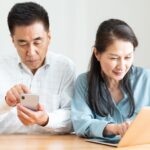 Older couple using technology together