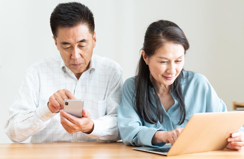Older couple using technology together