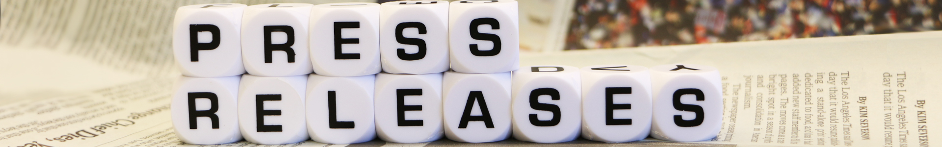 cubes with press release letters on top