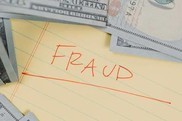 a paper with a word fraud on it