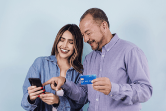 Two people hold their bank cards and smiles